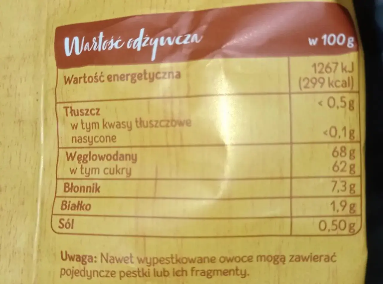 Tabela wartości odżywczych suszonych jabłek: 299 kcal w 100g, 68g węglowodanów, 62g cukrów.